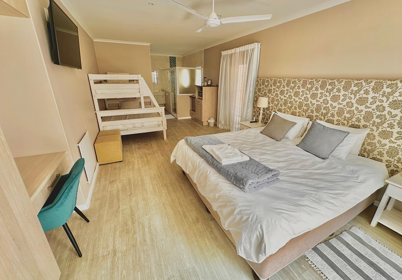 Retreat on Main | Luxury family room with private deck and kitchenette